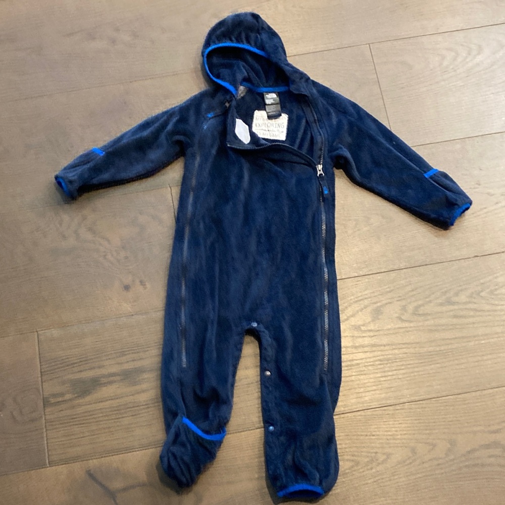 The North Face fleece onesie. Hooded with ability to wrap hands and feet inside.